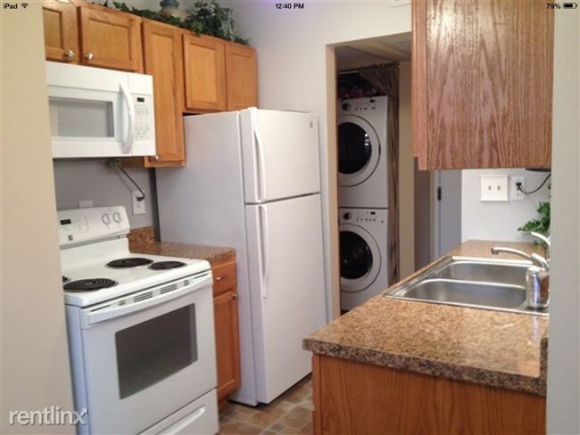 Washer and dryer off kitchen - 832 Bloomfield Village Blvd Unit "E"