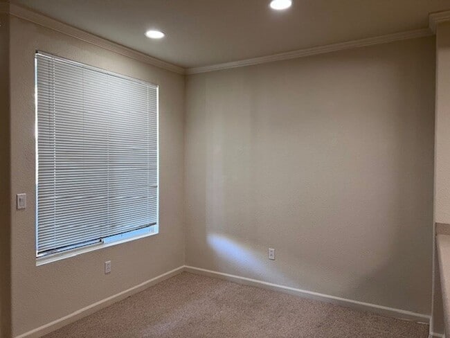 Photo - Gated condo with 1 car garage and community pool.