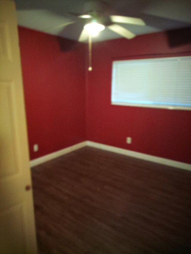Bedroom with laundry in pic 6 - 2100 W Beach Dr Unit F102