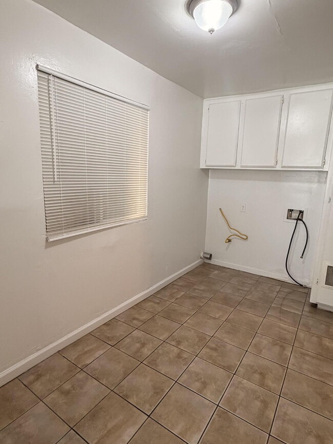 Photo - Spacious 3 Bed / 1 Bath Apartment with Open Layout & In-Unit Laundry Unit A