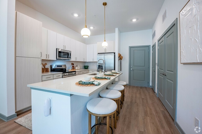 Modern kitchen with stylish pendant lighting. - Livano Sunlake