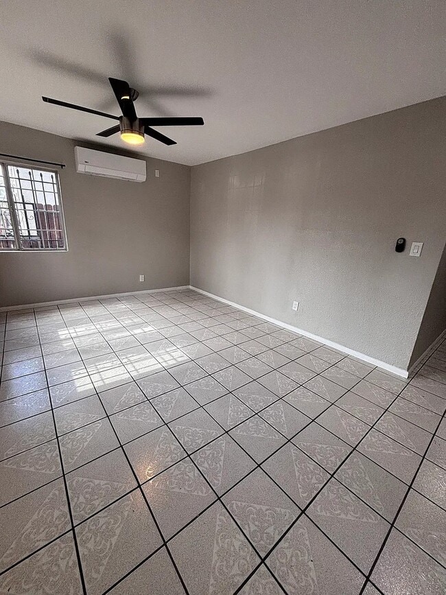 Bright and spacious living area with fresh paint and updated finishes throughout - 131 E 82nd Pl Unit 1