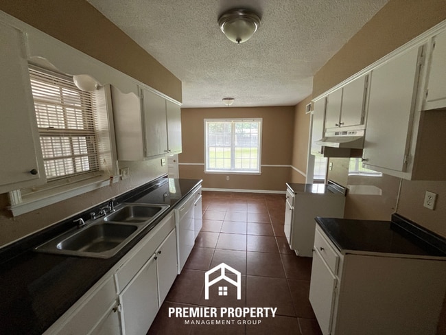 Photo - Spacious 4BR/2BA Whitehaven Home | 1,701 Sq Ft, Brick Fireplace & Quiet Cove