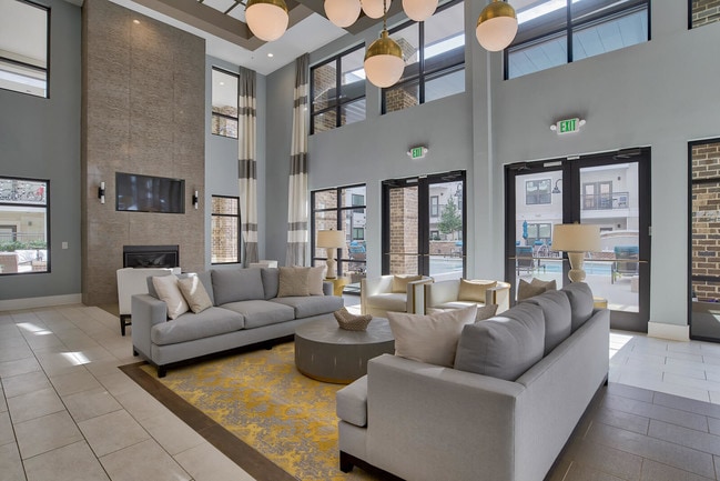 Lounge area, TVs and fire place in Entertainment Lounge