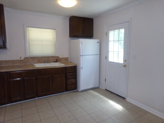 Photo - 2BR/1BA Milton Duplex with Huge Fenced Backyard, Tile Flooring Throughout & Convenient Access to ...