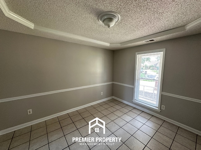 Photo - Beautiful 4BR/2BA Near Southwind | 1,853 Sq Ft, Dual Dining Areas, Fireplace & Garage