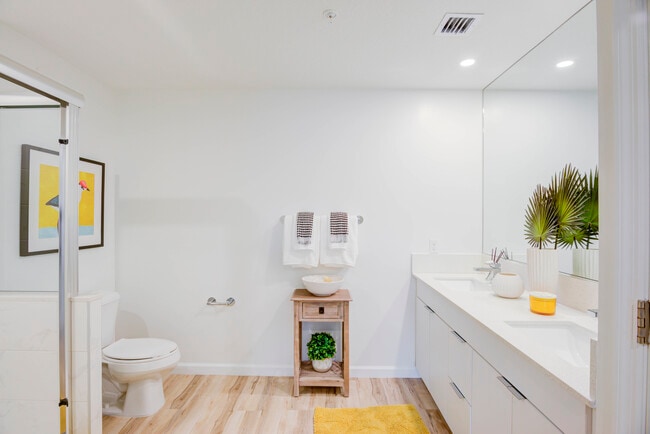 East Phase Bath with white cabinetry, white countertop, and hard surface flooring