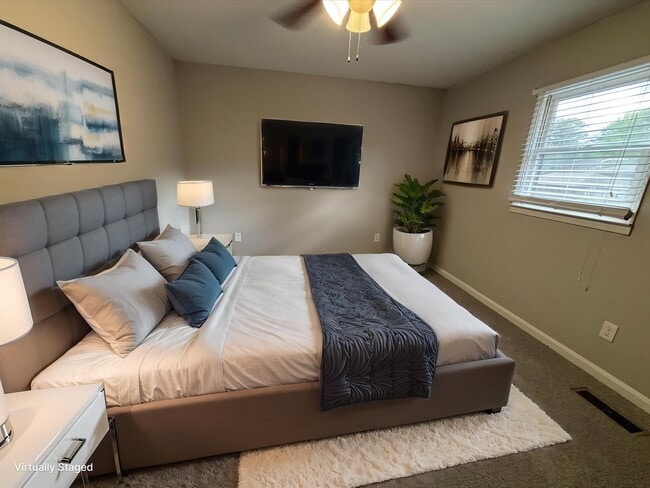 Step into comfort at Guest House, where modern design meets cozy living. This beautifully appointed bedroom offers a serene retreat with ample natural light and stylish decor. Don't miss your chance-schedule a tour today!