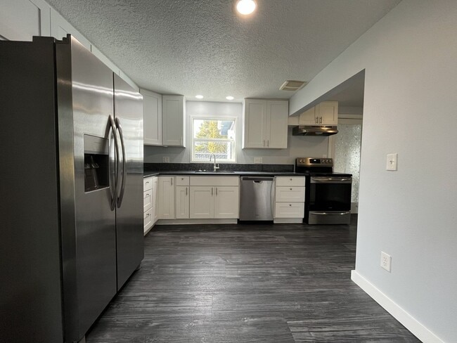 Photo - Updated Single-Level 3BD/2BA Home with Stainless Appliances, Expansive Yard & Flexible Layout