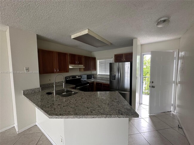 Building Photo - 8710 N Sherman Cir Unit 503 Rental