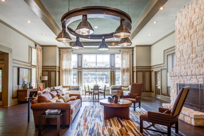 Community lounge with couch seating and a fireplace