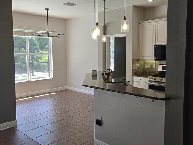 Photo - Freshly Painted 4BR/2BA Pool Home with Screened Pool & Spa – Move-In Ready!