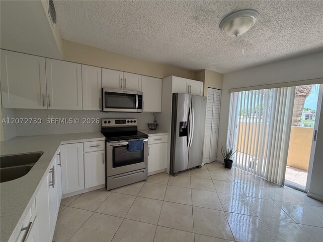 Building Photo - 14902 SW 82nd Ln Unit 13-205
