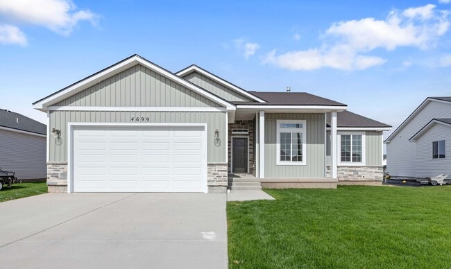 Building Photo - NEW HOME with large garage stalls and unfinished basement for additional storage