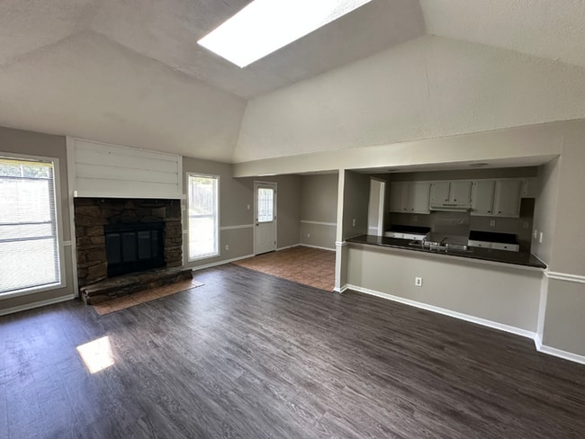 Photo - Charming 3BR/2BA Near Southwind | Soaring Vaulted Ceilings, Rustic Fireplace & Garage