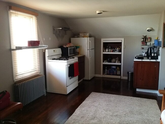 Small kitchen with pantry not shown, microwave, stove, fridge - 126 Clover Hill St Unidad Second Floor Apartment