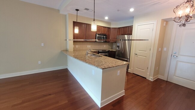 kitchen area with pantry - 200 River Vista Dr Unit 529