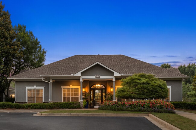 Lush landscaping and modern design create the perfect first impression.