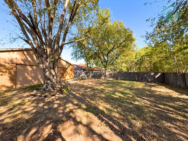Photo - Cozy 3-Bedroom Home with Fireplace, Covered Patio & Large Fenced Backyard for Lease