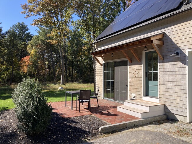 Apartment entry and private patio - 399 Lowell Rd House