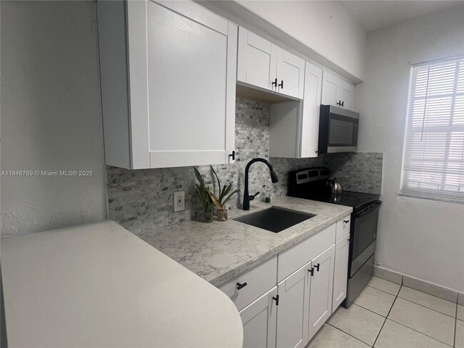 Building Photo - 6860 Abbott Ave Unit 4