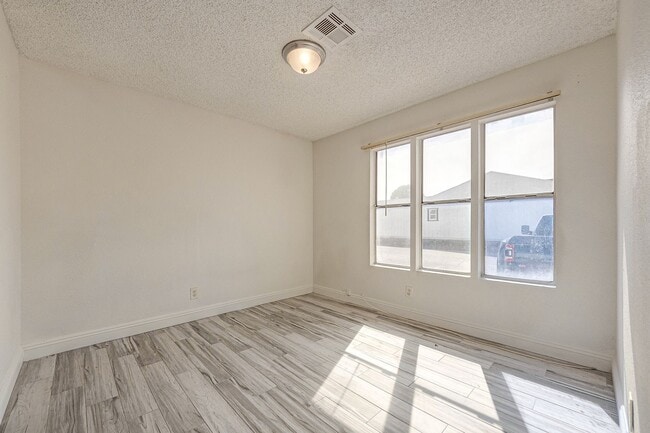 Photo - Charming Single-Level Townhome with Modern Flooring & Update Bathroom & Kitchen