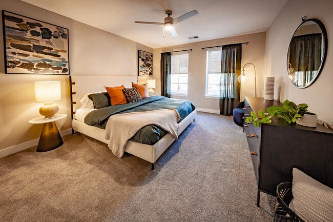 Spacious secondary bedroom with room for king-size furniture, oversized windows for abundant natural light, and privacy shades included in every apartment home.