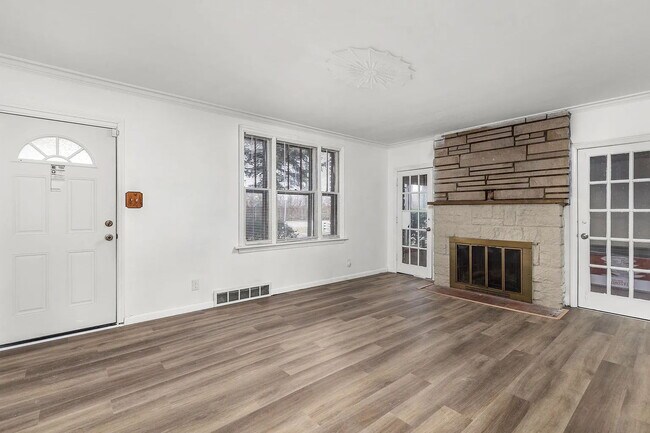 Photo - "Cozy 2-Bedroom, 1 bath Retreat with Fireplace Charm!"  One car garage, section 8 ok.