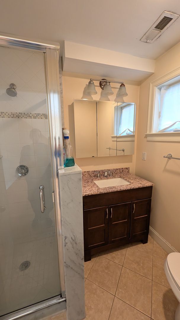 Photo - Spacious Townhouse: 4-bed, 3.5 bath unit in Brighton with Garage Parking