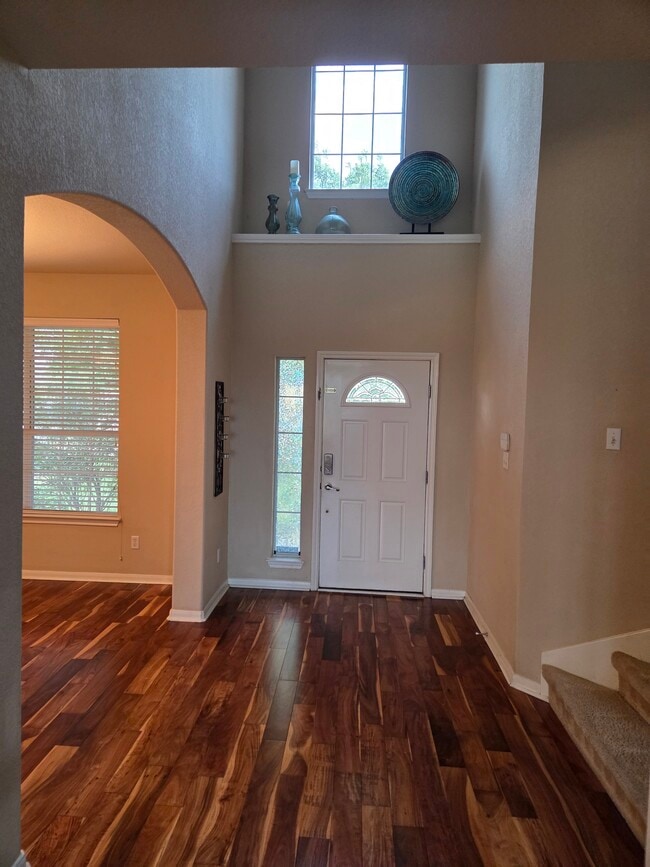 Foyer. Left is formal dining or office. Right is stairs