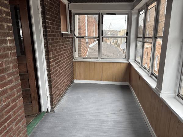 Enclosed front porch - 505 1/2 Jackson Ave