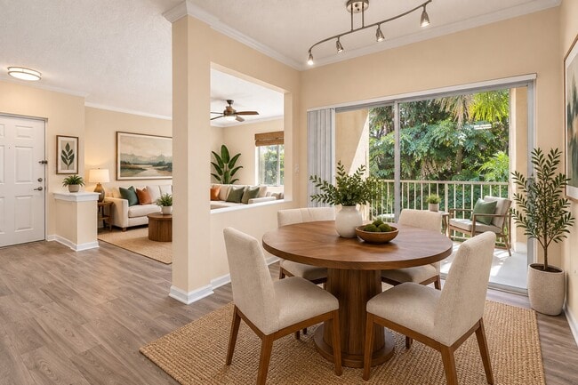 Elevate your living at Ibis Reserve with this inviting dining area, perfect for gatherings and serene views. Enjoy modern design and comfort in every corner. Ready to find your ideal home? Schedule a tour today!