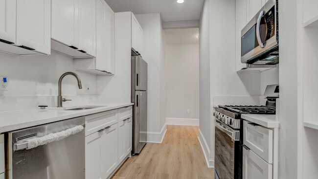 Photo - Spacious 4-Bedroom, 2-Bathroom Apartment i... Unit 2