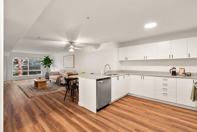 A full wraparound counter run gives you real prep space, with the dining area and living room just steps away.