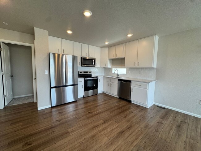 Photo - Modern 3-Level Home with Dual Balconies, Open Floor Plan & Bonus Flex Space