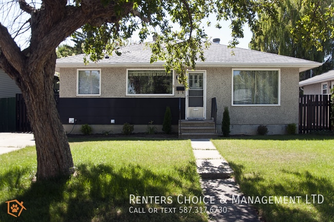 Building Photo - Dog Friendly Main Floor Suite with Fenced Yard & Driveway Parking