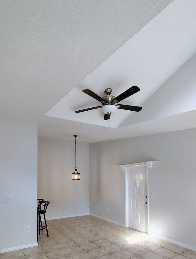Dining room by entry door - 1353 Pine Ridge Cir E Unit 128 E3
