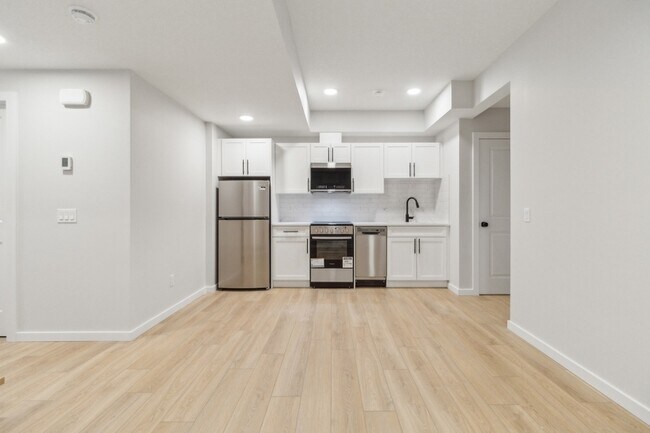 Photo - 21003-21025 25 Ave NW