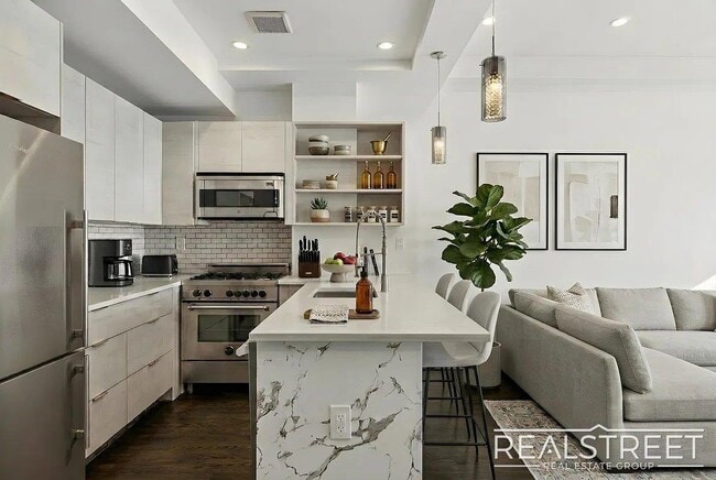 Photo - Modern Bushwick 2-bedroom, 2.5-bath duplex with private garden, deck, and finished recreation room —