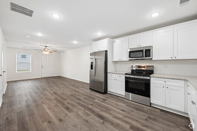 2BR, 2.5BA - 1,022SF - Kitchen/Living Room - Villages at Ram