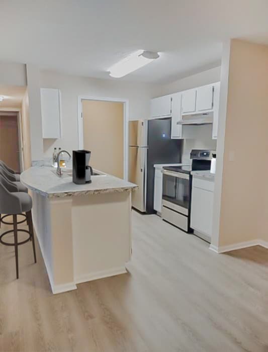 Cook and entertain in style with our contemporary kitchens, featuring sleek countertops, modern appliances, and ample cabinetry for all your culinary needs. - The Links Apartments