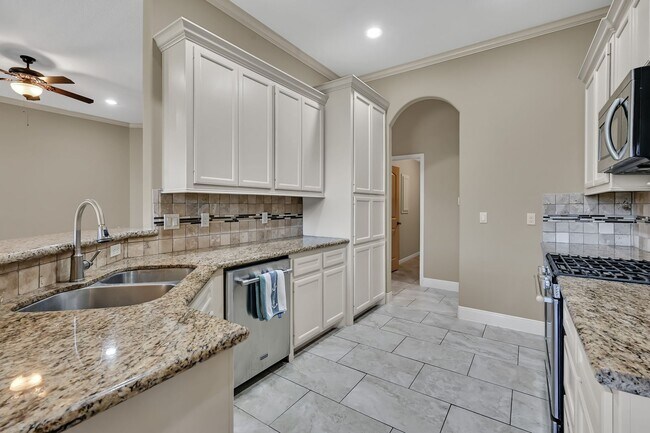 Photo - One story, and a 3-car garage!