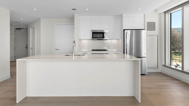Kitchen with Breakfast Bar and Stainless Steel Appliances