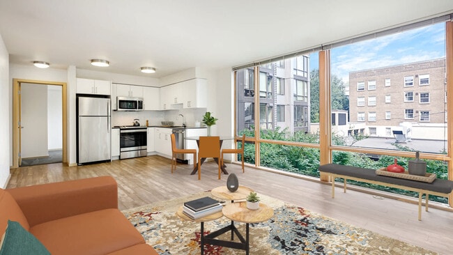 Cocina y sala de estar con ventanales de piso a techo