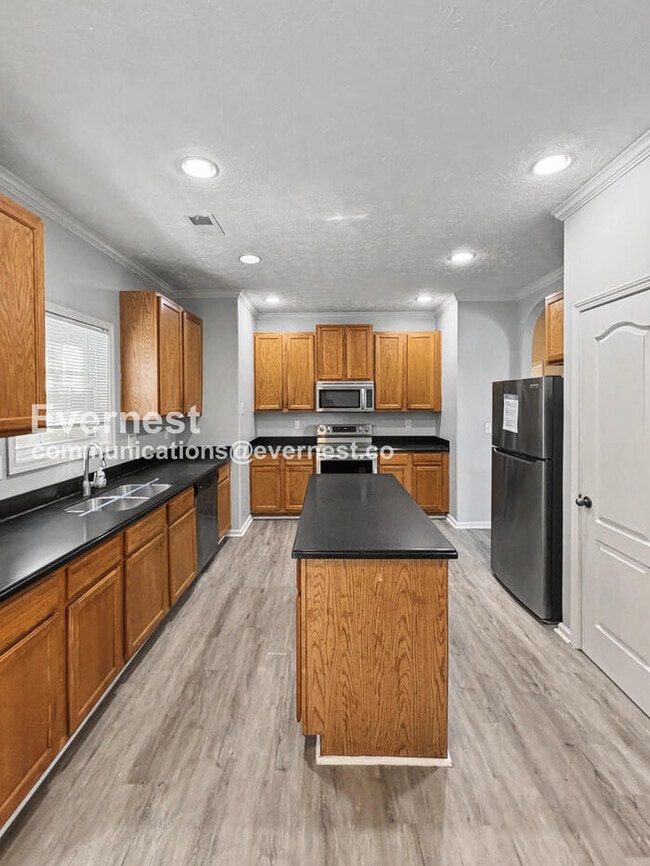 Photo - 4 Bed, 2 Bath Home with Garage / Pet-Friendly / Available Now!