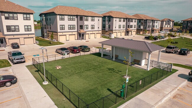 Our pet-friendly community includes tons of green space and a large fenced-in dog park. - Legacy 34