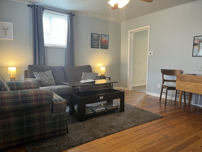 Fully furnished home with full couch some comfy chairs. - 414 S Commercial St House