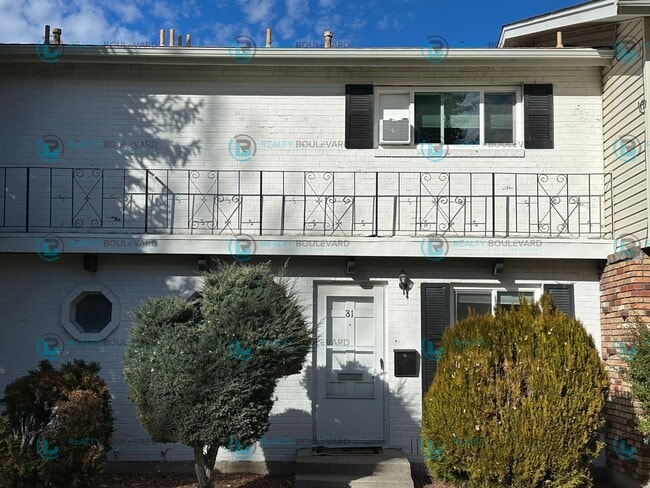 Photo - 2-bed, 2-bath, 2-story townhome with pool and park like setting outside the front door.