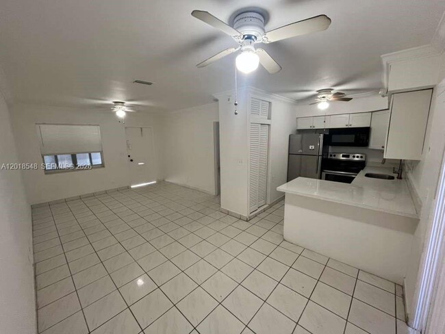 Building Photo - 2450 Lincoln St Unit 7