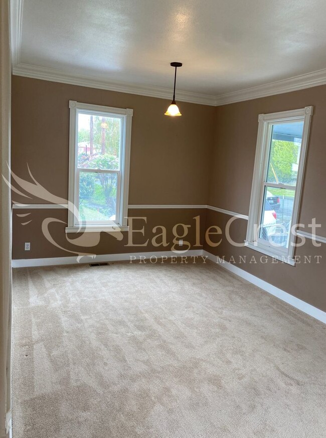 Charming 2 Bedroom Home With 1 Car Garage and A Covered Porch